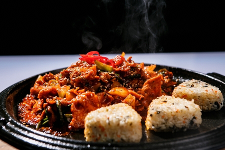 Korean-style stir-fried spicy pork with vegetables (jeyuk-bok-eum)の写真素材