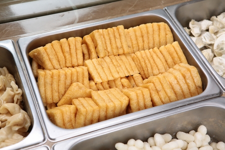 Ingredients for shabu-shabu, such as fried tofu, hand-pulled dough, rice cakes, dumplings