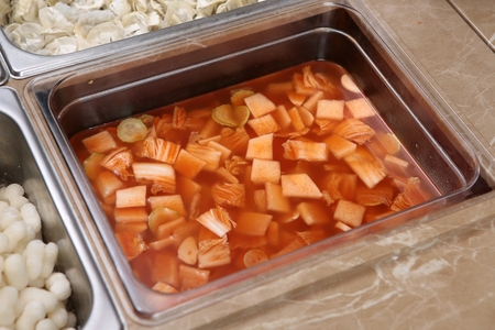 Ingredients for shabu-shabu, such as rice cakes, dumplings, and watery kimchiの写真素材