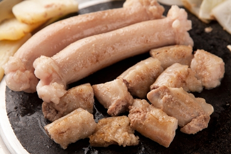 Pork tripes, potatoes, onions, mushrooms on grillの写真素材