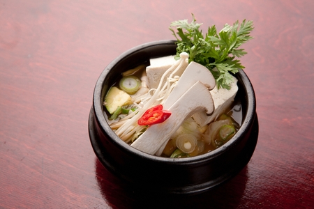 Bean paste soup in pot, on tableの写真素材
