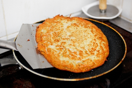 Mung beans pancakes cooked on a frying panの写真素材