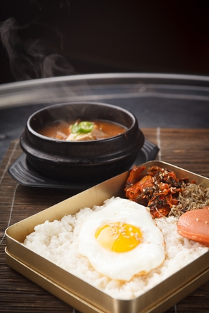 Lunchbox with rice, eggs and side dishesの写真素材