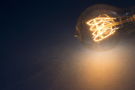 Light bulb glowing as Business idea concept with concept creative thinking and innovative solutions. 057の写真素材