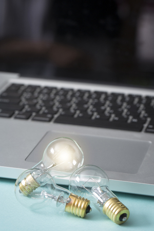 Light bulb glowing as Business idea concept with concept creative thinking and innovative solutions. 067の写真素材