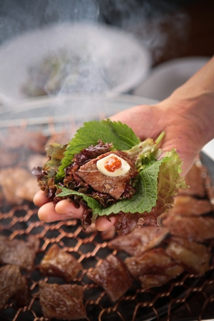 Perilla leaf, marinated pork spareribs, garlic, sauce, wrapped in lettuce