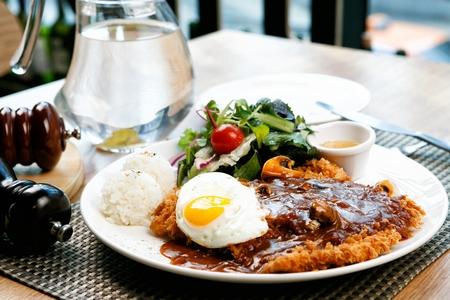 Tonkatsu, japanese dish of fried pork cutlets sprinkled with sauce