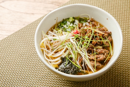 Naeng-udon, japanese cold noodle dish with thick noodles served in cold broth with vegetables