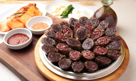 Korean sausages with sweet rice, vegetables korean sausages, salt and sauce on silver plate,...