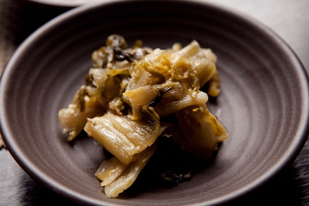 Matured ripened kimchi on round plate, close-upの写真素材