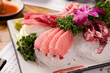 Raw tuna on steamed seaweed noodles, on rectangular plateの写真素材
