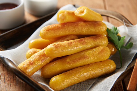 Rice cake with sweet pumpkin stuffing, on rectangular treyの写真素材