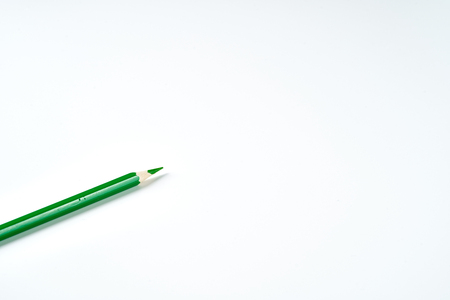 Green pencil on white backgroundの写真素材