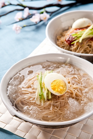 Buckwheat noodles with cucumber and egg, in bowlの写真素材