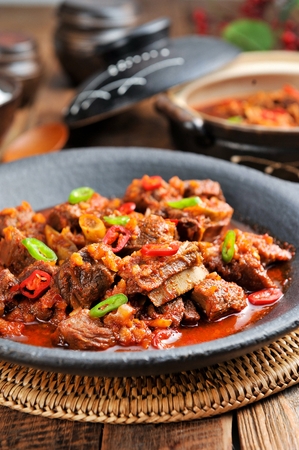 Braised spicy beef short ribs with chili and welsh onions, in china bowlの写真素材