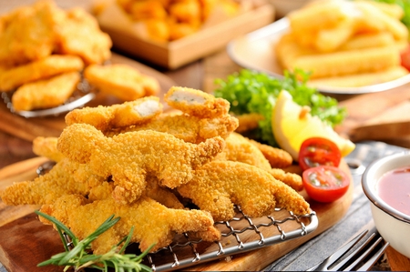Chicken nuggets on cutting boardの写真素材