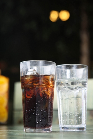 Coke and cider in glass with iceの写真素材