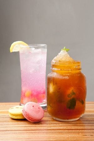 Pink lemonade with lemon, and Iced americano in glassの写真素材