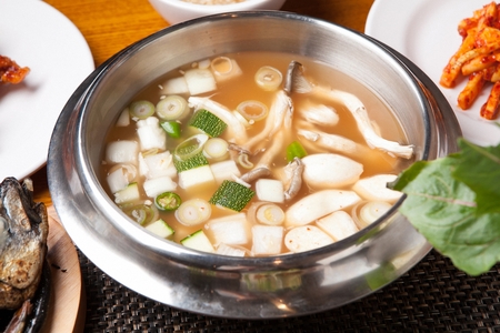 Bean paste stew with pumpkins and mushrooms, in bowlの写真素材