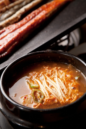 Spicy eel stew with mushrooms, in potの写真素材