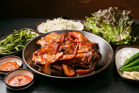 Pig feet with chili on china plate, with vegetablesの写真素材