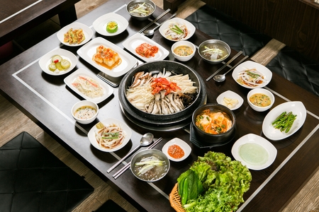 Bulgogi with mushrooms on plate, with side dishesの写真素材