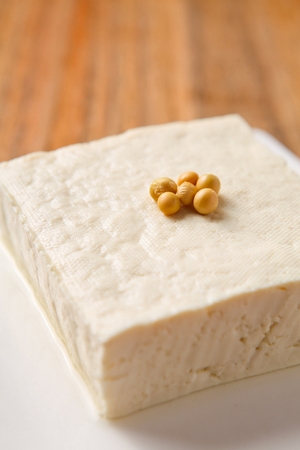 Tofu with beans on top served on plateの写真素材