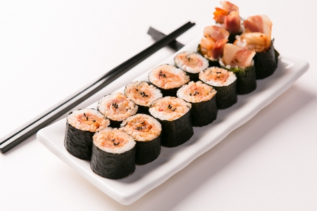 Kimchi Korean Sushi roll served on plate with chopsticksの写真素材