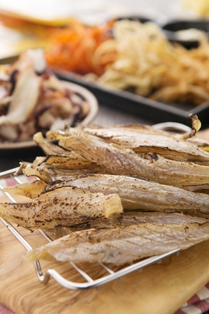 Grilled Dried Snacks served on wooden plateの写真素材