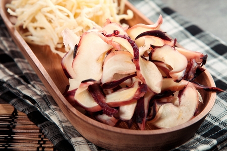 Dried Snacks served on wooden plateの写真素材