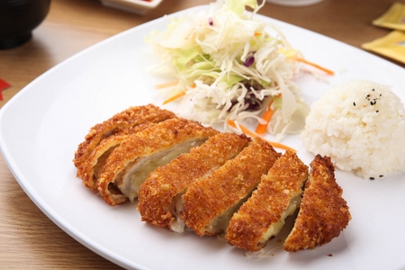 Sliced Cheese Pork Cutlet with rice and salad served on plate
