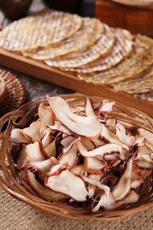 Grilled Dried Snacks served on wooden plateの写真素材