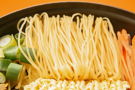 Spicy Rice Cake with Noodles with Glass Noodles and Eggs served on pan