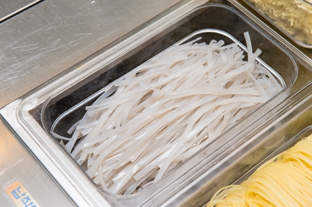 Glass Noodle Spicy Rice Cake noodle in containerの写真素材