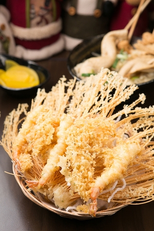 Fried Shrimp, Fish Cake Kebab and pickled radish served on bamboo plateの写真素材
