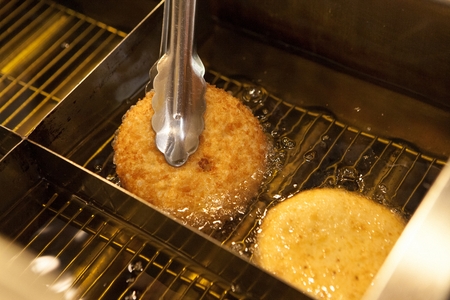 Croquette being fried on a fryer