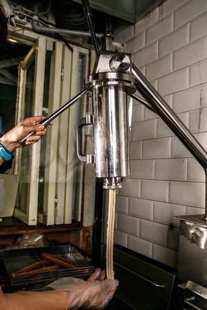 Cooking Method to create dough to make churros from churro machineの写真素材