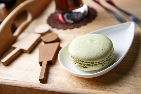 Macarons and Ribbon Decoration on plateの写真素材