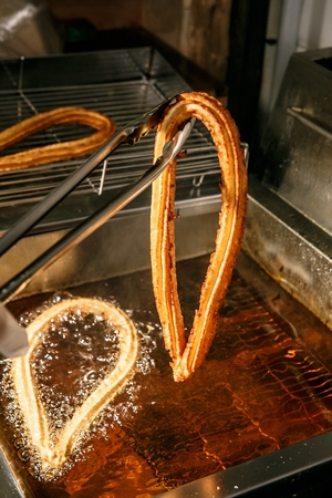 Cooking Method to fry churros in a fryerの写真素材