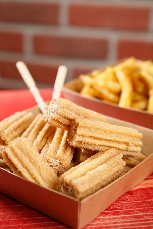 Churros wrapped in packing paperの写真素材