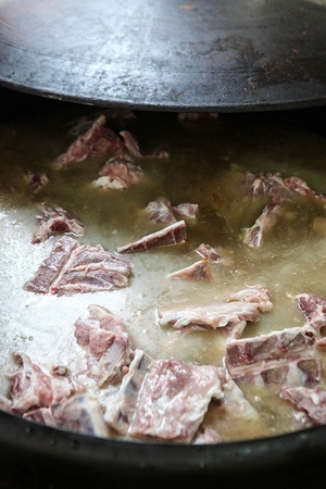 Pork bones boiled in a cauldronの写真素材