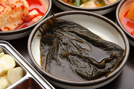 pickled sesame leaf in soy sauce, on plate
