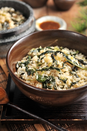 Korean cuisine - Gondeure-namul-bap, seasoned thistle with rice in stone potの写真素材