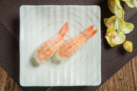 shrimp sushi on porcelain plateの写真素材