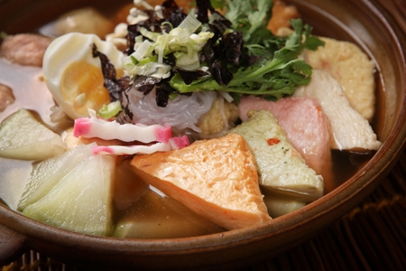 fish cake soup with mushroom, crown daisy and dried seaweedの写真素材