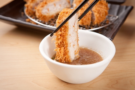 deep fried pork sirloin dipped in sauceの写真素材