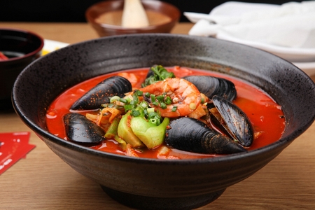 Korean-Chinese cuisine, Jjambbong, spicy seafood noodle soup with shrimp, mussel and bok choyの写真素材