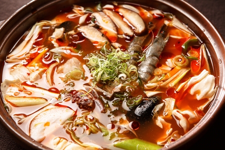 Korean-Chinese cuisine, Jjambbong, spicy seafood noodle soup with vegetables in Ttukbaegi, earthen potの写真素材