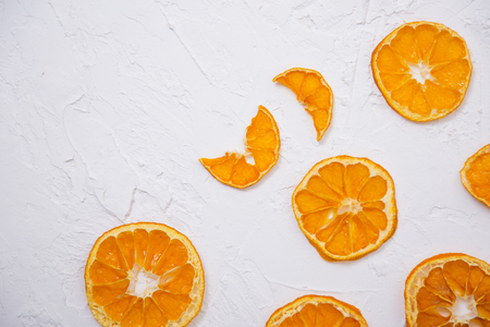 Collections of sliced tangerines on a white background. Fruit composition.の写真素材