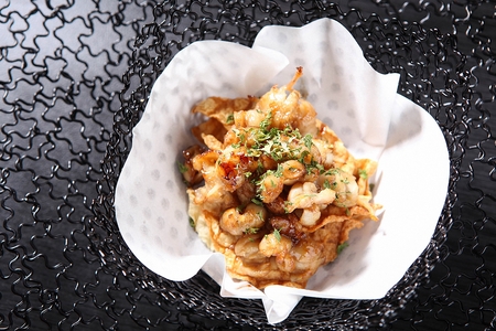 fried filefish with grilled squid on transparent plateの写真素材